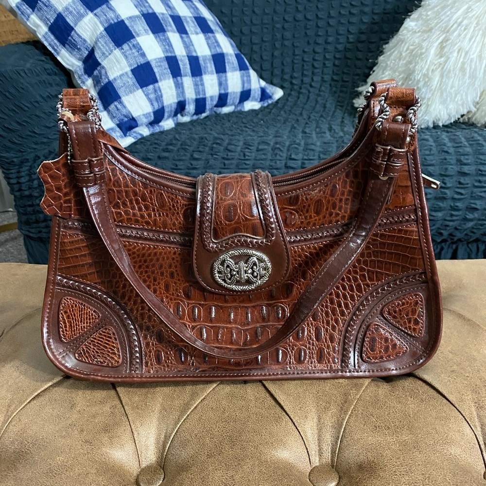 M.C. brown embossed genuine leather purse
